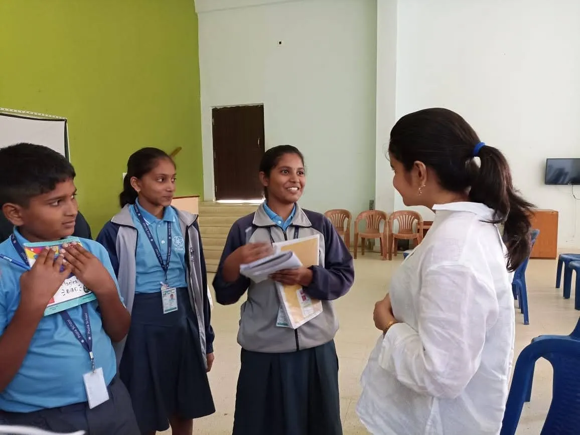 Senior students in easy discussion with their teacher