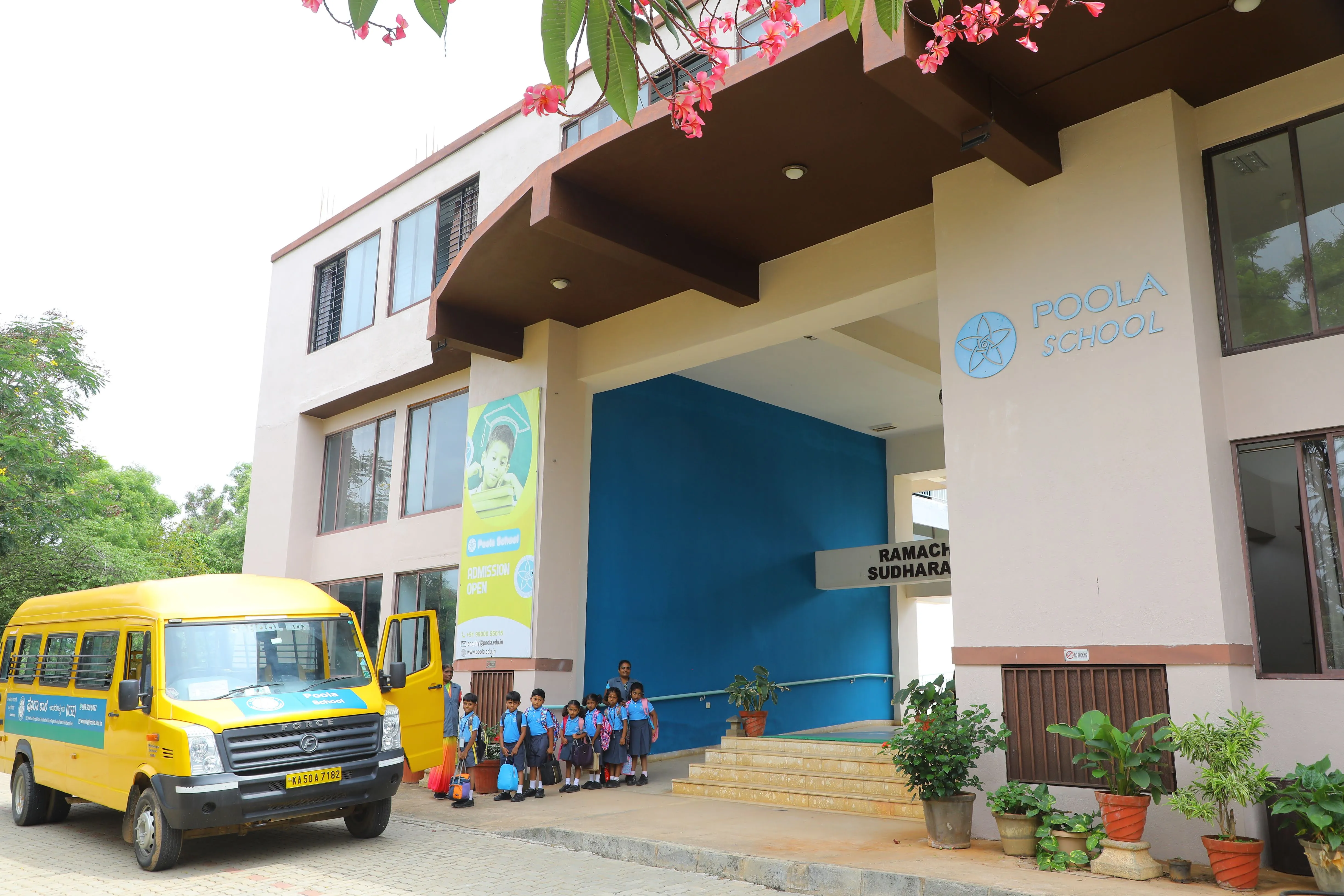 Children arriving under the entrance portico